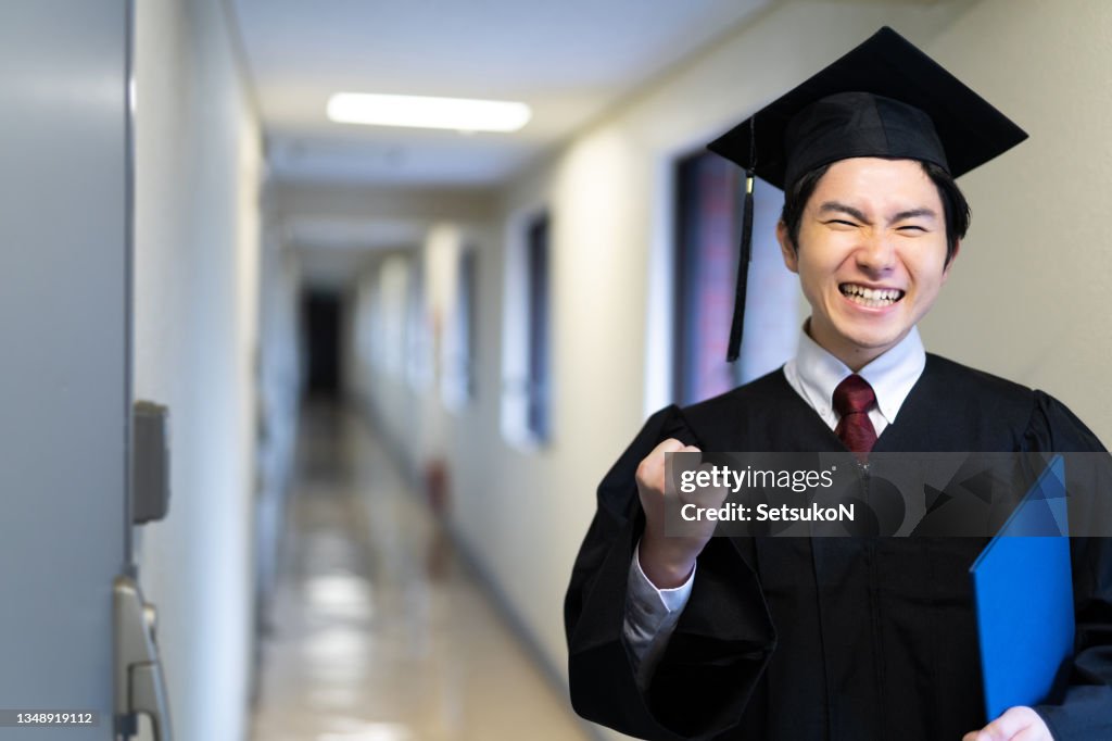 Portrait of male student on graduation day from university