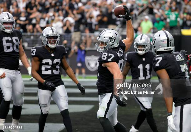 Tight end Foster Moreau of the Las Vegas Raiders spikes the ball in the end zone as he celebrates an 18-yard touchdown against the Philadelphia...