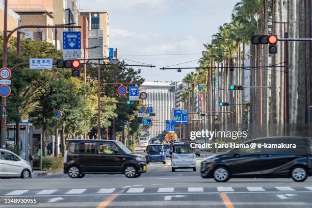 the city street in fukuoka city of japan - prefectura de fukuoka fotografías e imágenes de stock