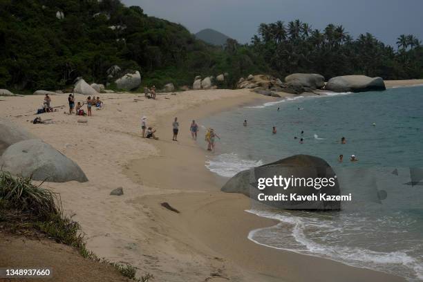 People swim in Tayrona National Park on August 6, 2021 in Tayrona, Colombia.