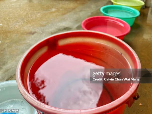 rain water in plastic bucket - bucket stock-fotos und bilder
