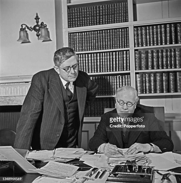Australian politician Herbert Vere Evatt , Minister for External Affairs and Attorney-General for Australia, stands on left with British Chancellor...