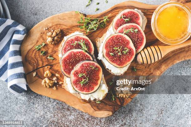 bruschetta with figs, ricotta cheese and honey - ciabatta stock pictures, royalty-free photos & images