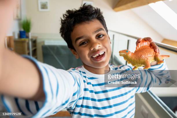 playing with dinosaurs - dinosaur toy i stock pictures, royalty-free photos & images