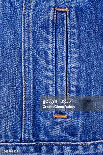 pocket of jeans jacket close-up - jean jacket stock-fotos und bilder