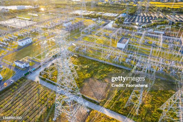 aerial view of  a big scale of super high voltage transformer power transformer substation in the sunset,shanghai,china - transformador fotografías e imágenes de stock