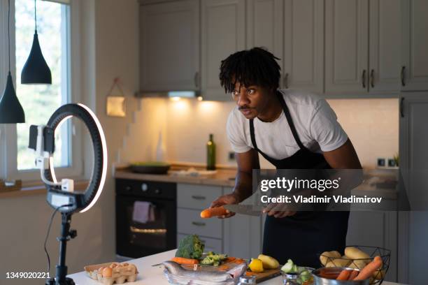 live streaming cooking a meal - chef male kitchen stock pictures, royalty-free photos & images