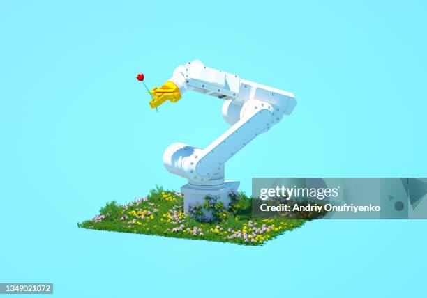 robotic arm holding flower - social intelligence stock pictures, royalty-free photos & images