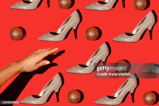 trendy fashion pattern with woman's hand and fashion high-heeled shoes. - glitter shoes stock pictures, royalty-free photos & images
