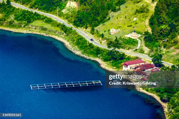 aerial view of lake toba in huta lontung, muara. - lake toba sumatra stock pictures, royalty-free photos & images