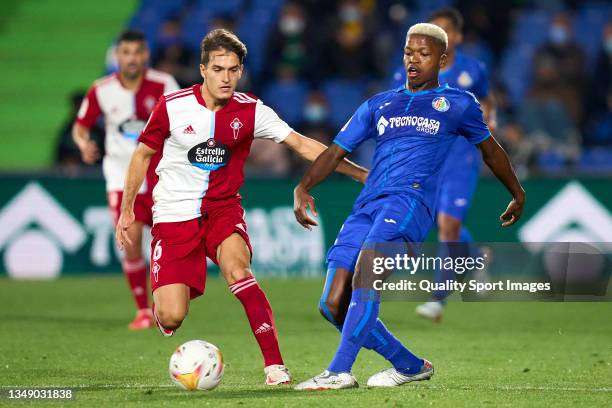 Florentino of Getafe CF battle for the ball with Denis Suarez of RC Celta de Vigo during the La Liga Santander match between Getafe CF and RC Celta...