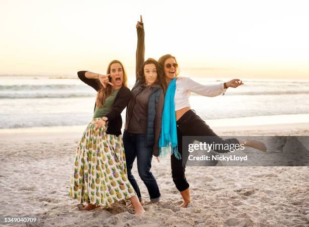 carefree group of friends having fun on the beach - crazy girlfriend stock pictures, royalty-free photos & images