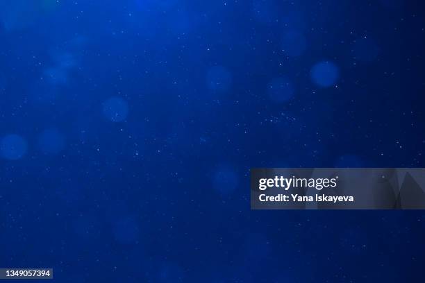 deep blue night sky and abstract space background with stars as astronomy concept - blauer hintergrund stock-fotos und bilder