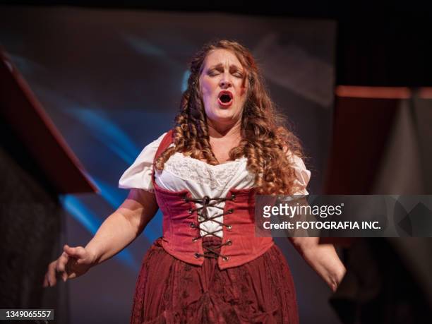 mature female performer on the stage - cantor de ópera imagens e fotografias de stock
