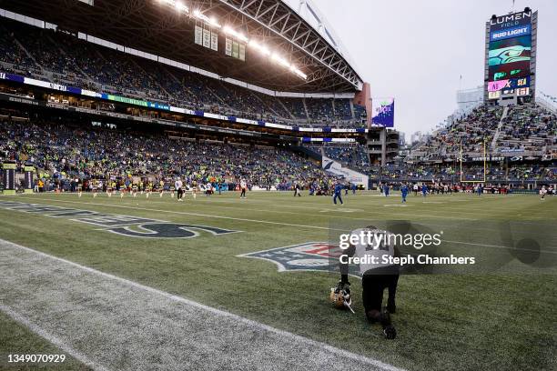 Terron Armstead of the New Orleans Saints kneels in the endzone prior to a game against the Seattle Seahawksat Lumen Field on October 25, 2021 in...