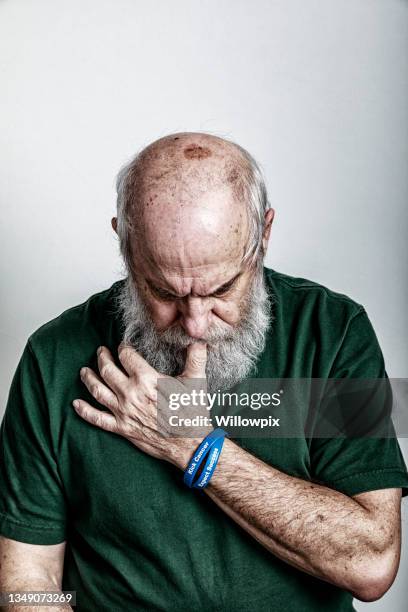 pensive senior adult man krebsüberlebender - keratosis stock-fotos und bilder