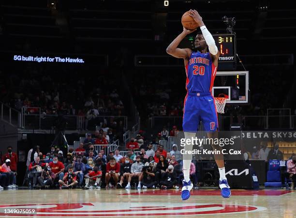Josh Jackson of the Detroit Pistons shoots a three-point basket against the Atlanta Hawks during the first half at State Farm Arena on October 25,...