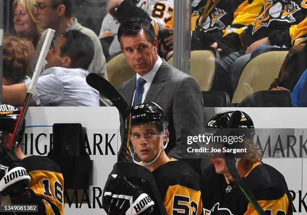 Head coach Mike Sullivan of the Pittsburgh Penguins looks on against the Dallas Stars at PPG PAINTS Arena on October 19, 2021 in Pittsburgh,...