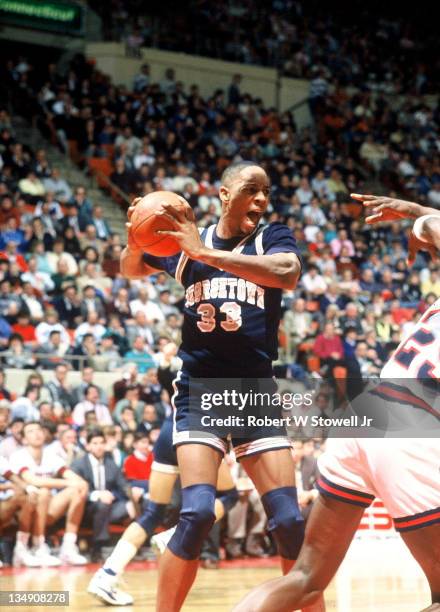 Georgetown's Alonzo Mourning tears down a rebound against the University of Connecticut, Hartford CT 1990.