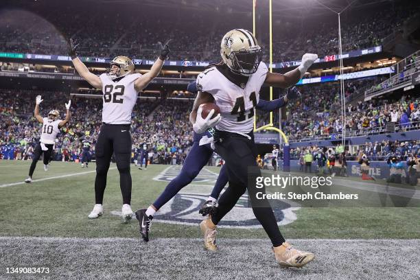 Alvin Kamara of the New Orleans Saints catches a pass for a touchdown during the first half against the Seattle Seahawks at Lumen Field on October...