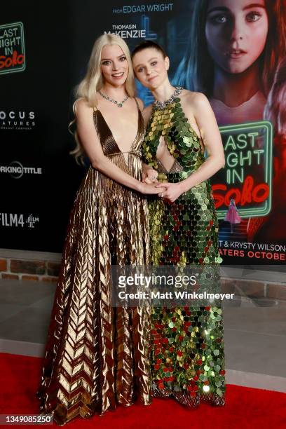 Anya Taylor-Joy and Thomasin McKenzie attend Focus Features' premiere of "Last Night In Soho" at Academy Museum of Motion Pictures on October 25,...