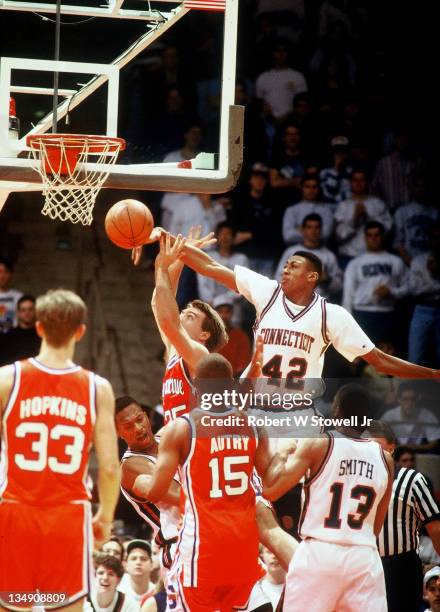 The University of Connecticut's Donyell Marshall rejects a shot against Syracuse, Hartford CT 1994.