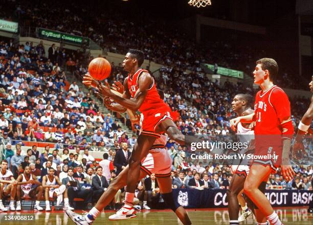 St John's Malik Sealy gains control of a loose carom against the University of Connecticut, Hartford CT 1989.