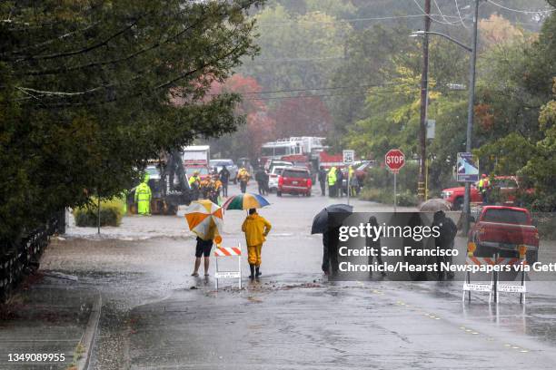 Residents on Tachevah Drive watch as crew battle flooding in this Santa Rosa, Calif. On Sunday, Oct. 24, 2021. Deemed by meteorologist as an...