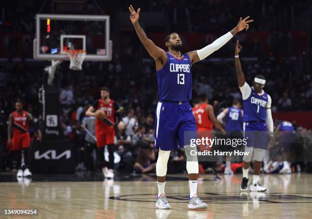 Paul George of the LA Clippers celebrates a three pointer from Luke Kennard with a Trail Blazer foul during the first half at Staples Center on...