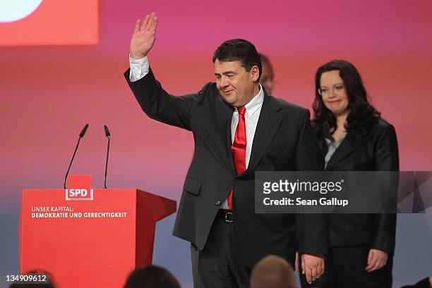 Newly-reelected leaders of the German Social Democrats General Secretary Andrea Nahles and Chairman Sigmar Gabriel arrive for a group photo shortly...