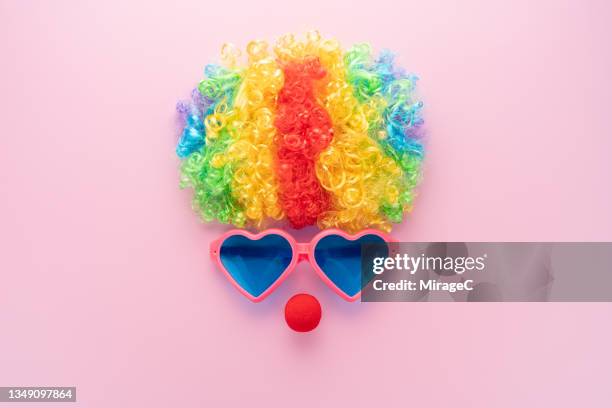 anthropomorphic clown face on pink - headwear stock pictures, royalty-free photos & images