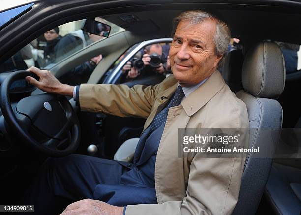 Head of Groupe Bollore, Vincent Bollore whose company is supplying the electric cars, poses inside an Autolib electric bluecar at the launch on...