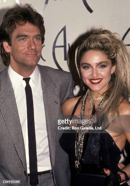 Singer Huey Lewis and singer Madonna attend the 12th Annual American Music Awards on January 28, 1985 at the Shrine Auditorium in Los Angeles,...