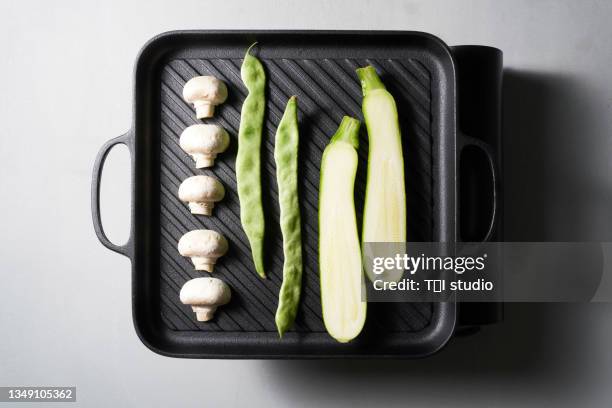 vegetables being roasted. - griddle stock pictures, royalty-free photos & images