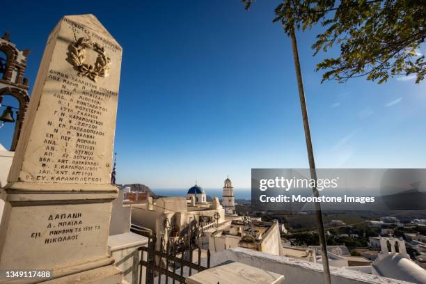 war memorial for balkan & greek turkish wars at church of agios nikolaos (st nicholas) in pyrgos kallistis on santorini, greece - greek war stock pictures, royalty-free photos & images