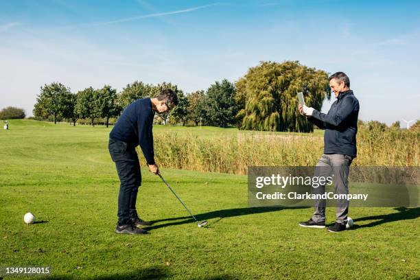 golf coach - golf lessons stock pictures, royalty-free photos & images