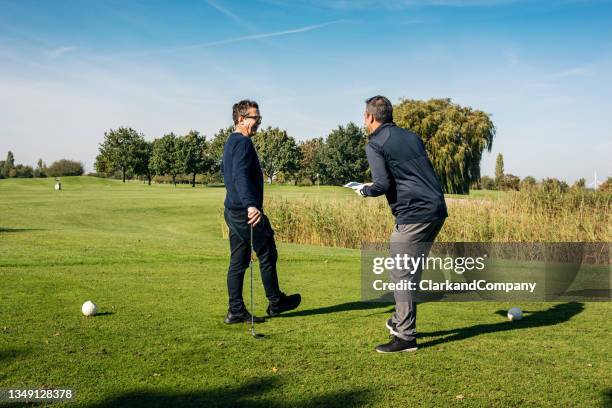 in the water at the golf course. - tee off stock pictures, royalty-free photos & images