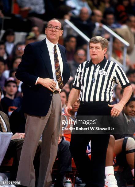 Syracuse University coach Jim Boeheim discusses a call with referee Jim Burr, during a game against the University of Connecticut, Hartford CT 1990.