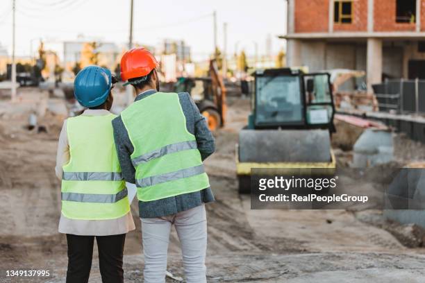 engineer team discuss and working at construction property site. - road works stockfoto's en -beelden