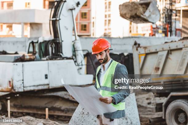 engineering man working at construction site. - person in suit construction stock pictures, royalty-free photos & images