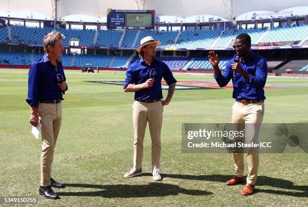 Commentators Mark Nicholas, Dale Steyn and Darren Sammy look on during the ICC Men's T20 World Cup match between South Africa and West Indies at...