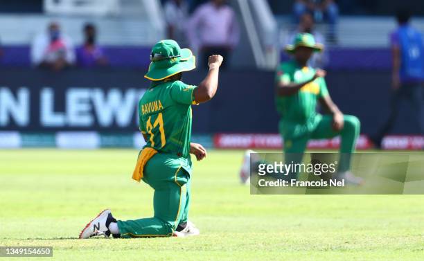 Temba Bavuma of South Africa takes the knee ahead of the ICC Men's T20 World Cup match between South Africa and West Indies at Dubai International...