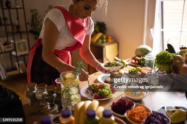 woman preparing vegan meal with fresh organic vegetables and veggie burger - iceberg lettuce stock pictures, royalty-free photos & images