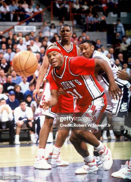 St Johns' Charles Mineland runs down a loose ball against the UConn Huskies, Storrs CT, 1992.