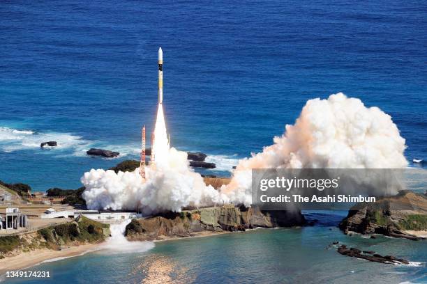 In this aerial image, The H-2A-44 rocket carrying a quasi-zenith satellite lifts off from the launch pad at JAXA Tanegashima Space Center on October...