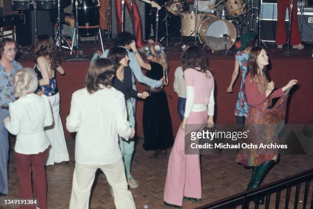 Clubbers on the dancefloor as an band perform on stage at the Whisky a Go Go, a nightclub on Sunset Boulevard in West Hollywood, California, circa...