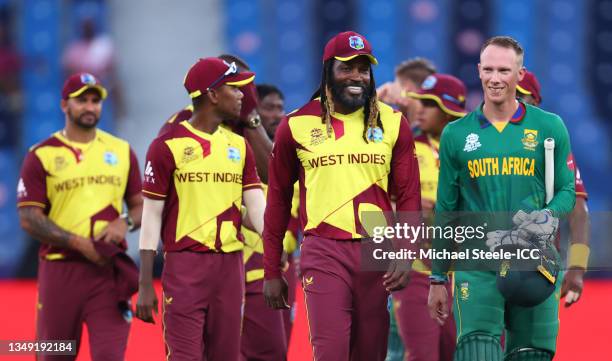 Chris Gayle of West Indies and Rassie van der Dussen of South Africa interact following the ICC Men's T20 World Cup match between South Africa and...