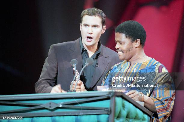 Johnny Vaughan and Joseph Shabalala during The 19th BRIT Awards 1999 with Mastercard, London Arena, London, UK, Tuesday 16 February 1999.