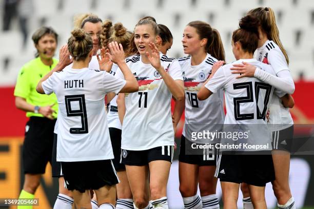 Laura Freigang celebrates the forth goal with her team mates during the FIFA Women's World Cup 2023 Qualifier group H match between Germany and...