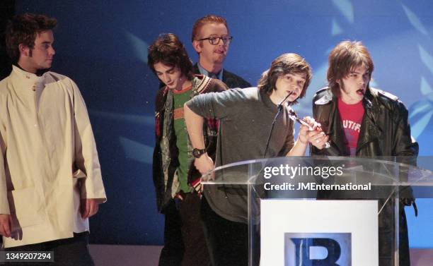 Supergrass win British Newcomer presented by Robbie Williams with host Chris Evans during The BRIT Awards 1996, Monday 19 February 1996, Earls Court...